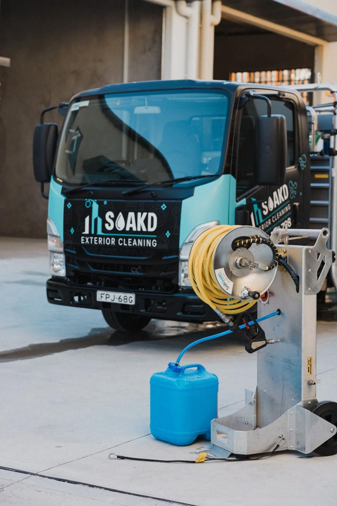 The branded SOAKD Exterior Cleaning truck on site